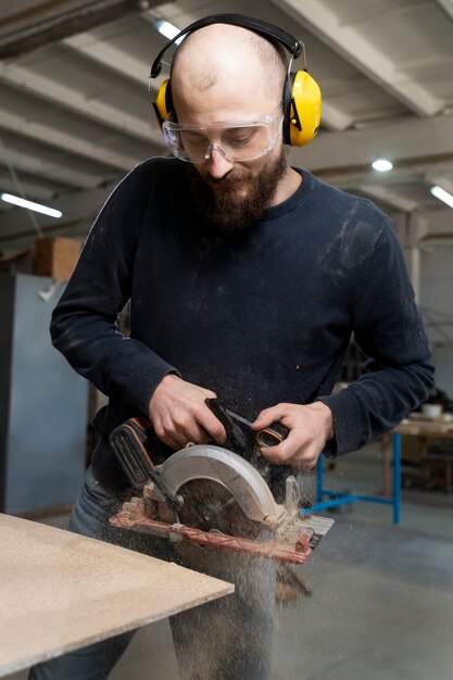 Man working on cutting mdf board