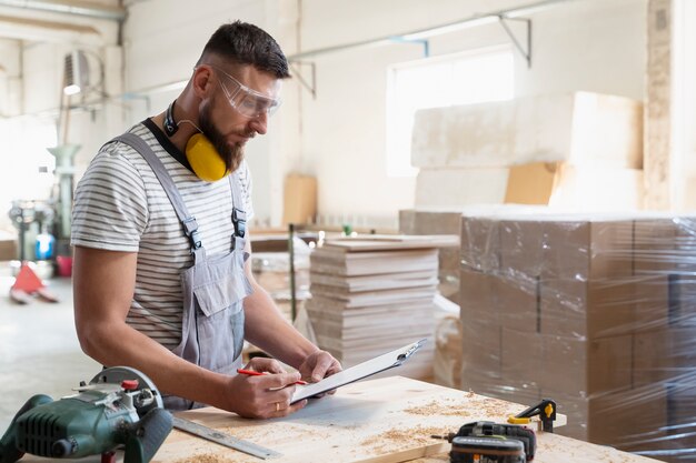 Man working on cutting mdf board