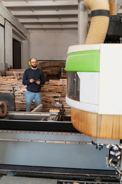 Free Photo man working on cutting mdf board