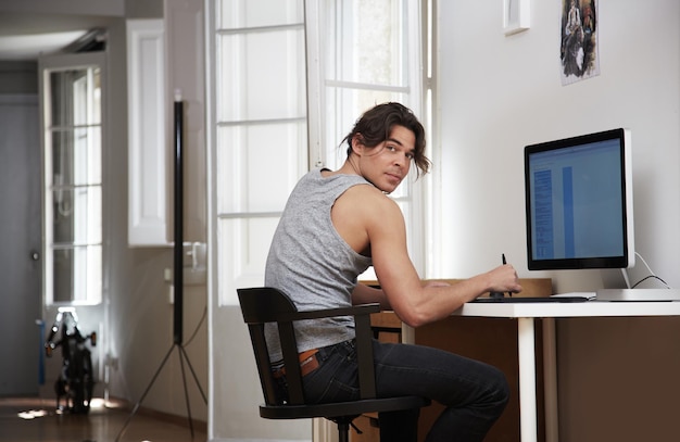 Man working in his apartment looking back