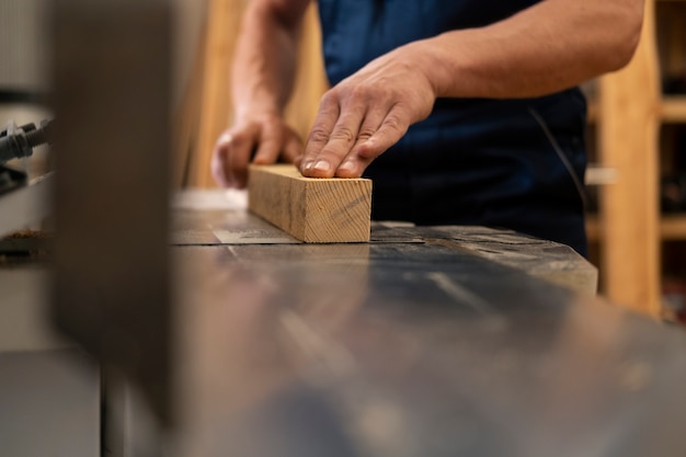 Man working in his wood shop with tools and equipment