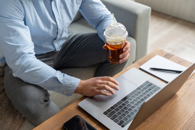 Man working on laptop high angle