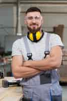 Free photo man working in a mdf boards warehouse