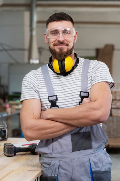 Free Photo man working in a mdf boards warehouse