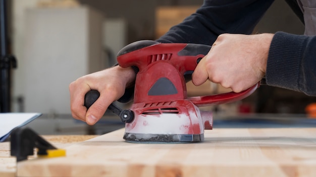 Free Photo man working in a mdf boards warehouse