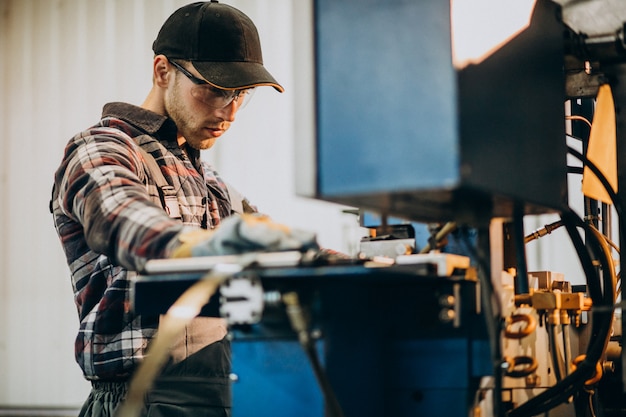 Free photo man working on steel fatory and equipment for steel production