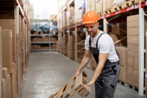 Man working in warehouse medium shot