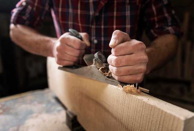 Man working with wood in workshop