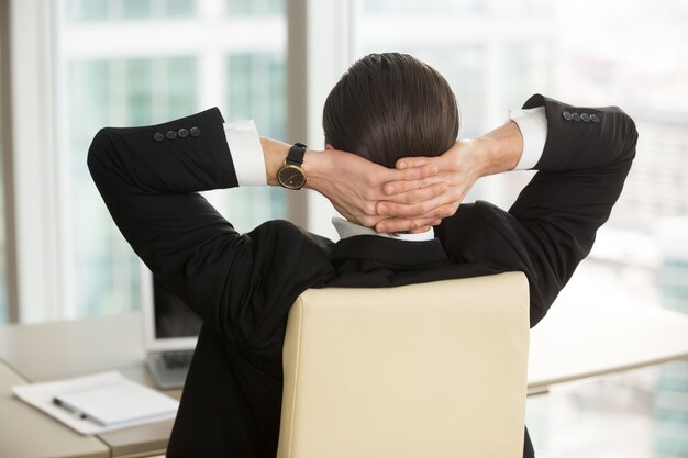 Manager resting after finishing work in office