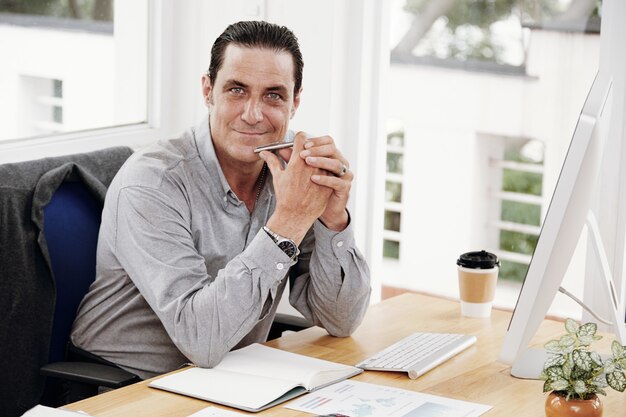 Manager sitting at his workplace