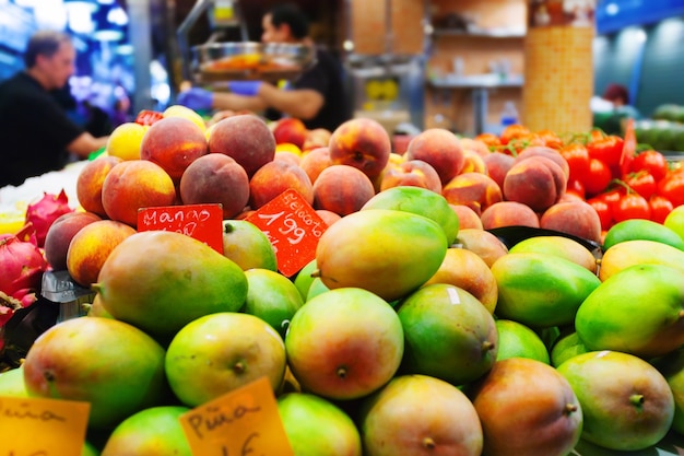 Mangoes and other fruits on counter