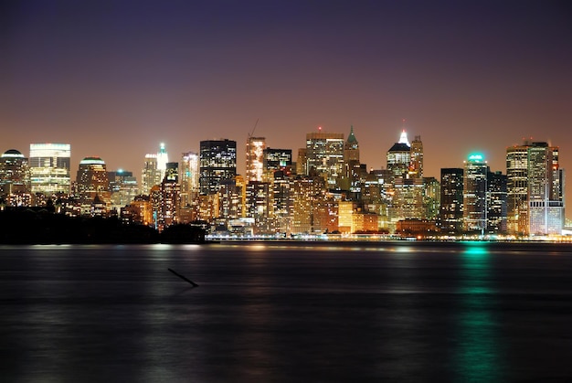 Free photo manhattan over hudson river, new york city skyline panorama with skyscrapers at dusk.