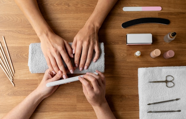 Manicurist holding nail tool close up