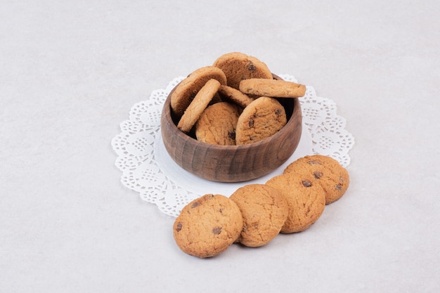 Many of sweet cookies on wooden plate