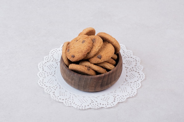 Many of sweet cookies on wooden plate