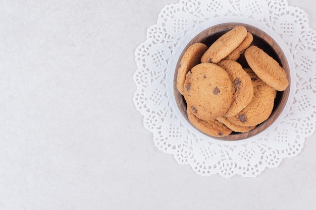 Many of sweet cookies on wooden plate