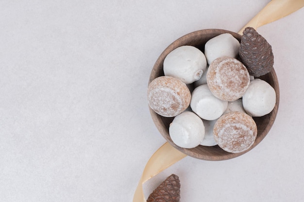 Many of sweet cookies on wooden plate