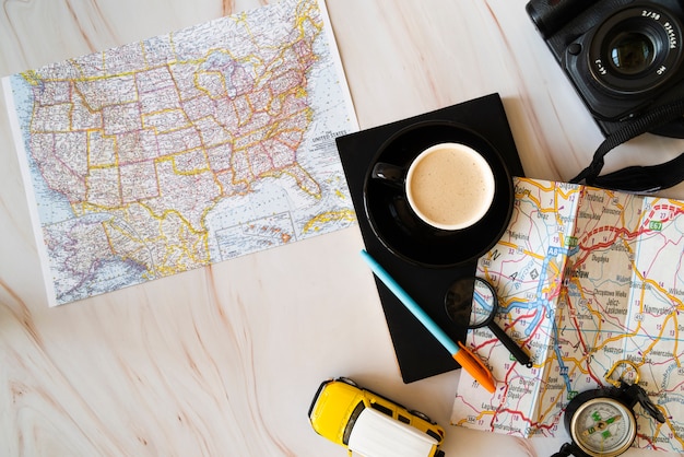 Maps on wooden background