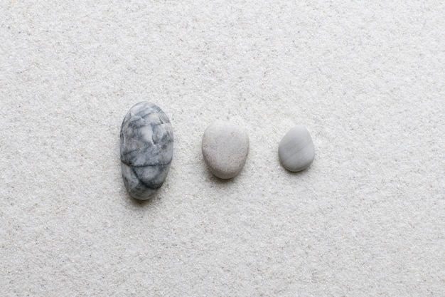 Free Photo marble zen stones stacked on white background in stability concept