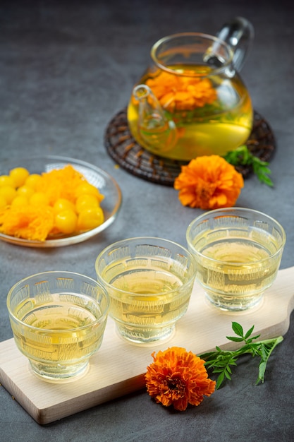 Free Photo marigold, lemon, honey herbal tea treatment concept.