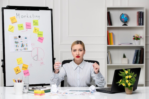 Free Photo marketing smart cute business lady in striped shirt in office angry holding fists