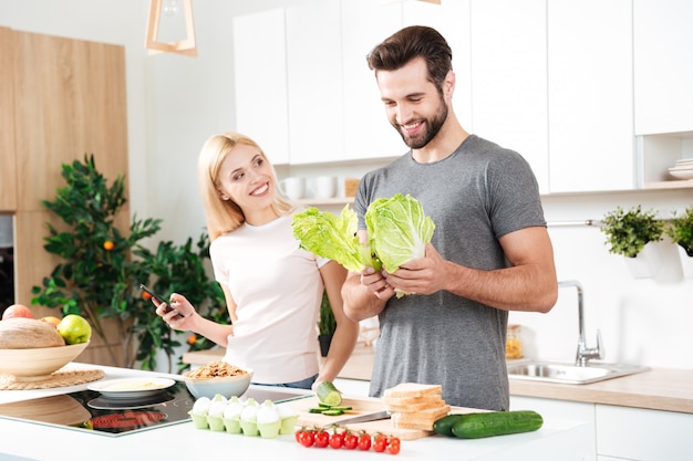 Free photo married young couple enjoying their time at home