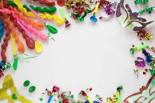 Free photo masks amidst balloons and confetti