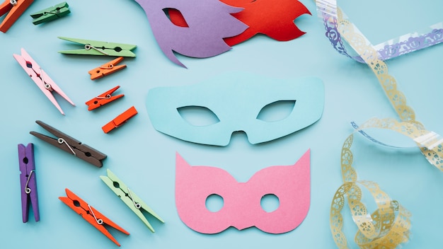 Free Photo masquerade  masks near pins and ribbon 