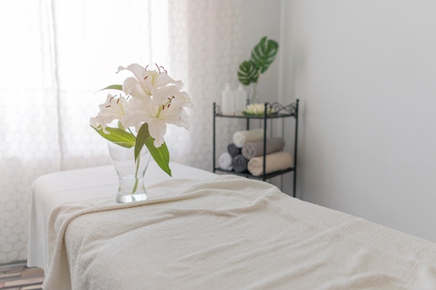 Massage table with white sheets