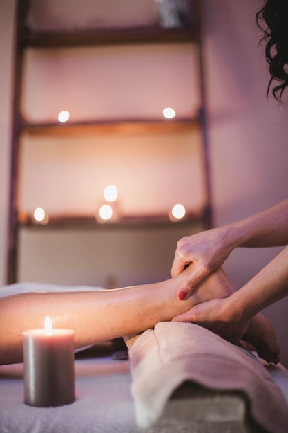 Massage therapist working with woman