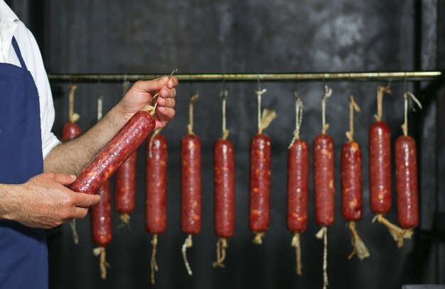 Massive sausage producted and hanged inside a factory