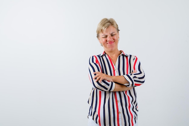 Free Photo mature blonde woman in a vertical-striped shirt