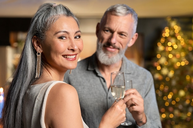 Mature couple enjoying some drinks on new year party