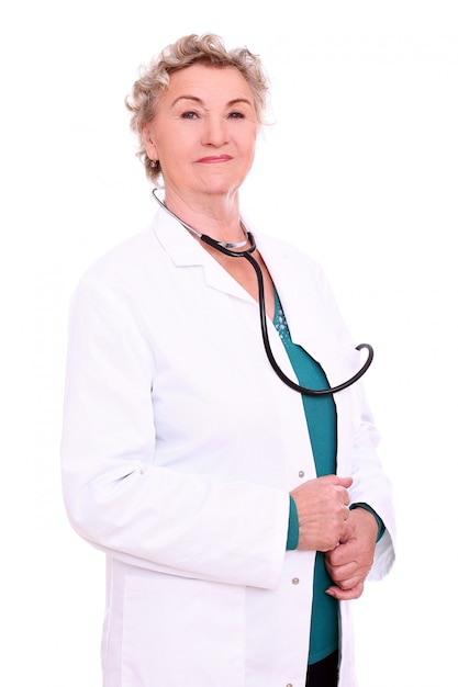 Free photo mature doctor posing on white