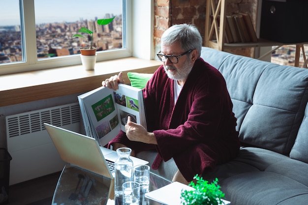 Mature senior older man during quarantine, realizing how important stay at home during virus outbreak