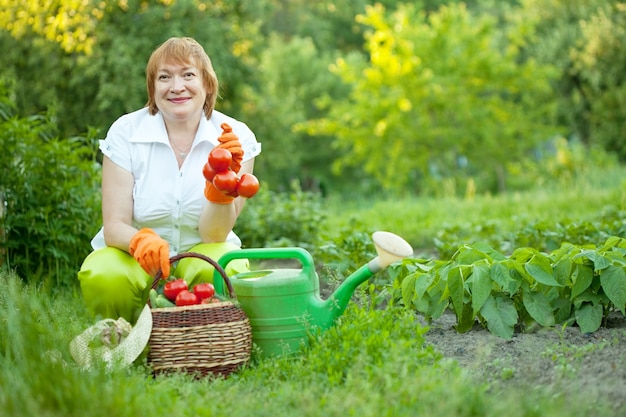 Free photo mature woman in  garden