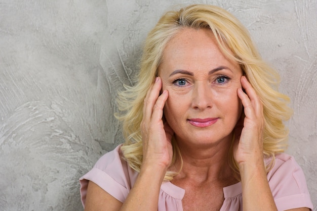 Mature woman having a little headache