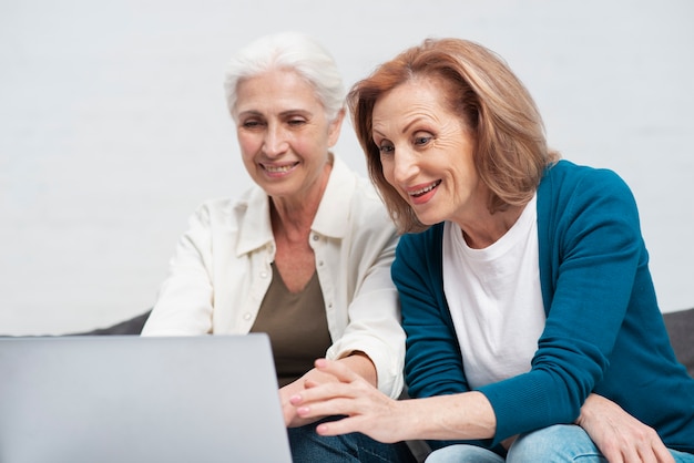 Mature women browsing on a laptop