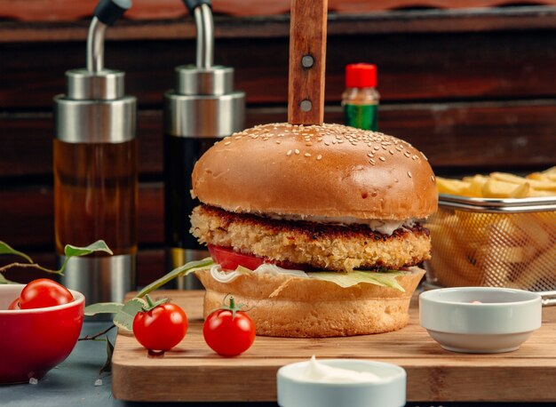 meat burger with lettuce, tomato and sauce