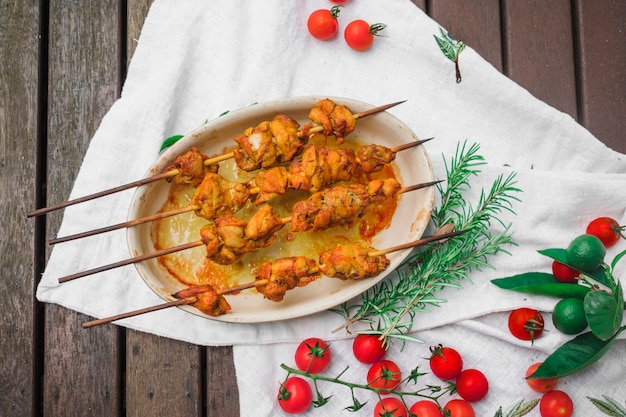 Meat kebabs served on table with tomatoes