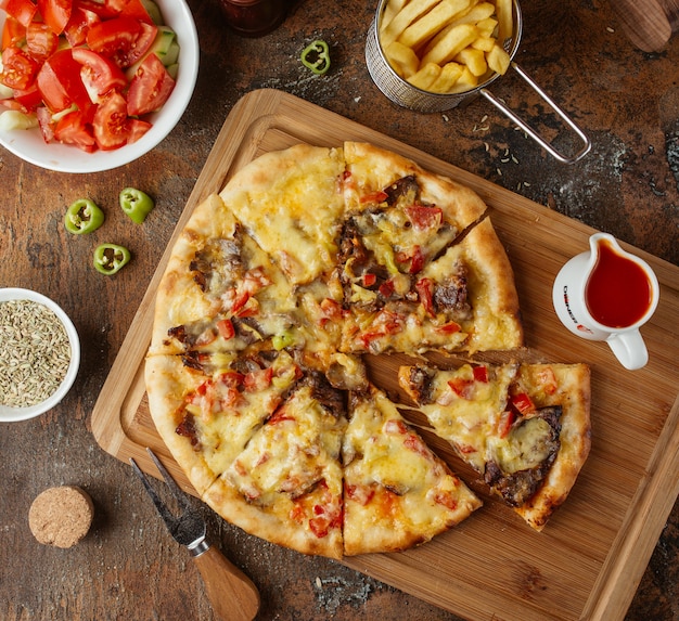 meat pizza with french fries top view