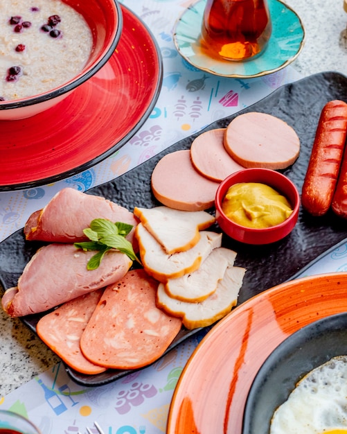 meat plate with sausages and sauce