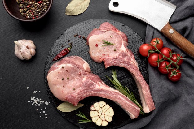 Meat prepared for cooking on wooden board