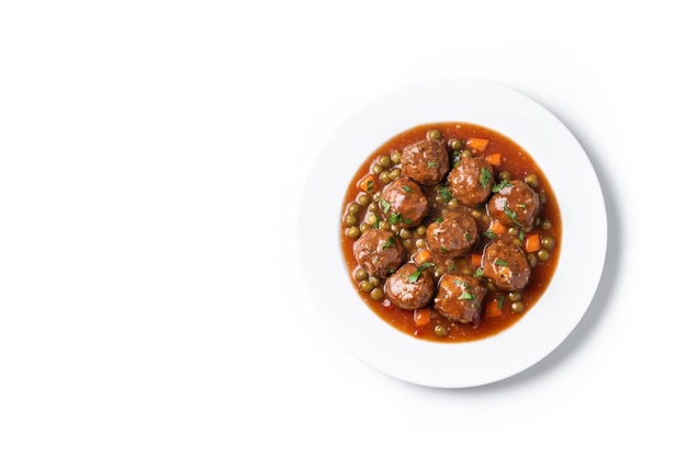 Meatballs green peas and carrot with tomato sauce isolated on white background