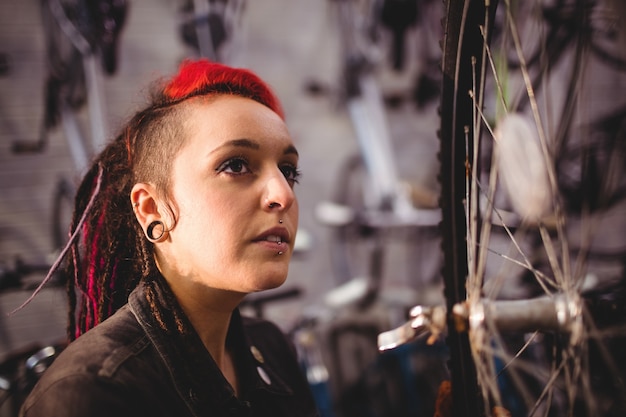 Mechanic examining a bicycle wheel