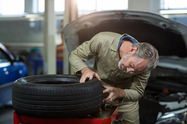 Mechanic examining a tyre