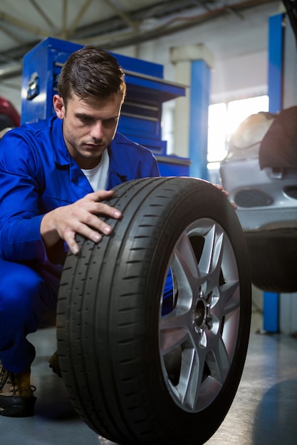 Mechanic examining tyre