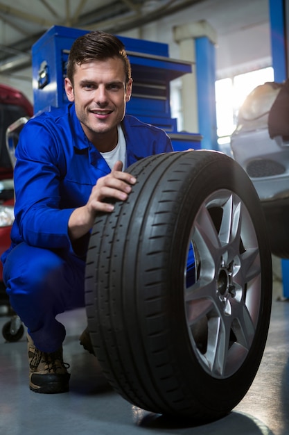 Mechanic examining tyre