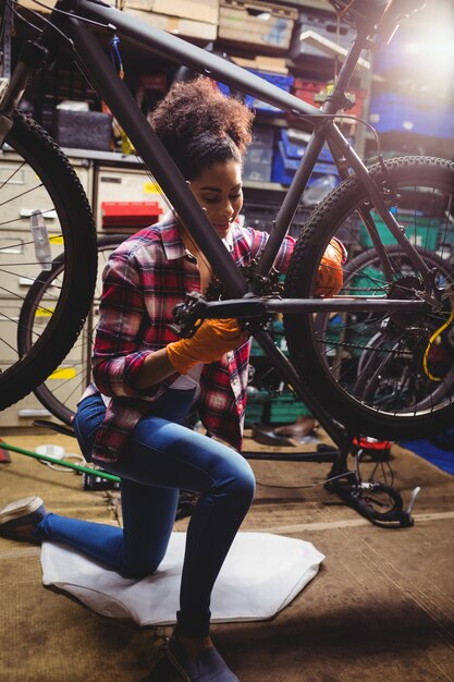 Mechanic repairing a bicycle