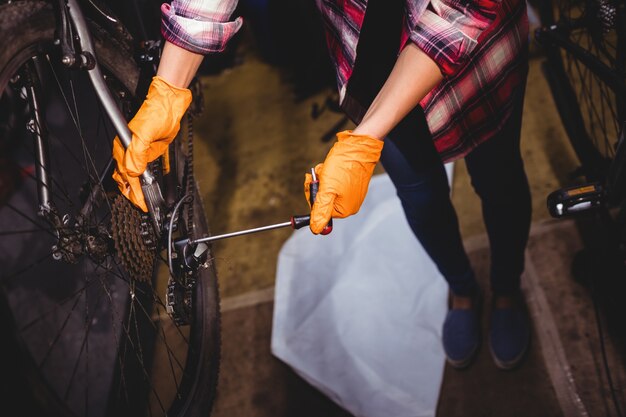 Mechanic repairing a bicycle